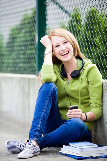 A girl sitting outside